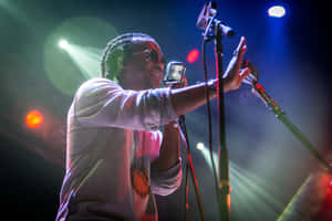 Lupe Fiasco Performing Liveon Stage Wallpaper