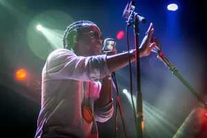 Lupe Fiasco Performing Liveon Stage Wallpaper