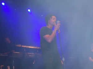 Lupe Fiasco Performing Liveon Stage Wallpaper