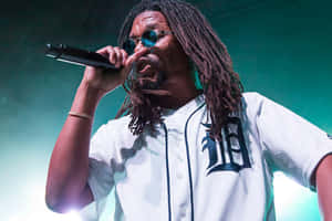 Lupe Fiasco Performing Liveon Stage Wallpaper