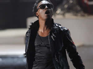 Lupe Fiasco Performingon Stage Wallpaper