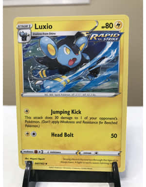 Luxio Trading Card On A Stand Wallpaper