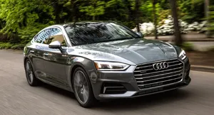 Luxurious Audi A5 Sportback On A City Road Wallpaper