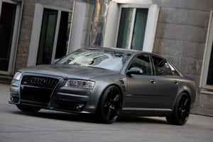 Luxurious Audi S8 Cruising Along The Highway Wallpaper