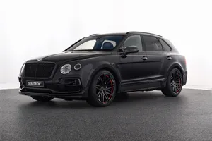 Luxurious Bentley Bentayga Cruising On A Scenic Route Wallpaper