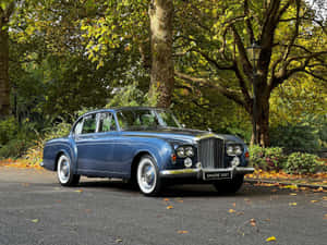 Luxurious Bentley S3 In Elegant Setting Wallpaper