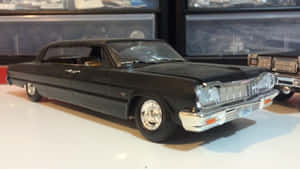 Luxurious Black Sports Car On An Open Road Wallpaper