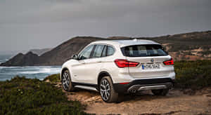 Luxurious Bmw X1 On A Scenic Drive Wallpaper