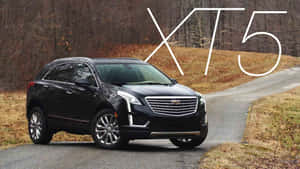 Luxurious Cadillac Xt5 On Scenic Drive Wallpaper