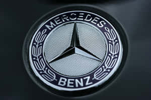 Luxurious Car Logo - Close-up View Of A Prestigious Car Emblem Wallpaper