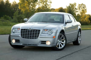 Luxurious Chrysler 300 Cruising The City Streets. Wallpaper