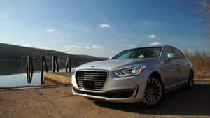 Luxurious Genesis G90 Gliding On An Open Road Wallpaper