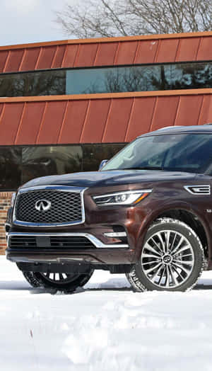 Luxurious Infiniti Qx80 Cruising In The City Wallpaper