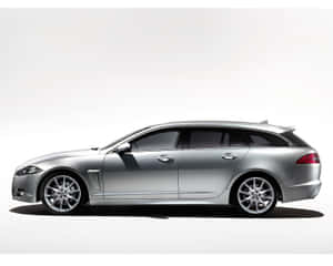 Luxurious Jaguar Xf Cruising The City Streets Wallpaper
