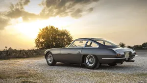 Luxurious Lamborghini 400 Gt Cruising The Highway Wallpaper
