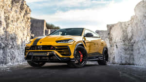 Luxurious Lamborghini Urus In Vibrant Cityscape Wallpaper