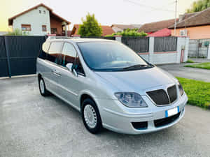 Luxurious Lancia Phedra In Sunlight Wallpaper