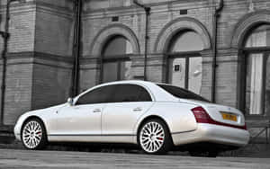 Luxurious Maybach 57 Gliding On An Open Road Wallpaper