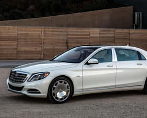 Luxurious Maybach Gliding Down The Road Wallpaper