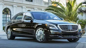 Luxurious Maybach Sedan On The Open Road Wallpaper