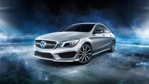 Luxurious Mercedes-benz Driving Through The Streets Wallpaper