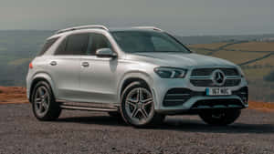 Luxurious Mercedes Benz Gle-class Under A Glowing Sky Wallpaper