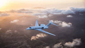 Luxurious Private Jet Soaring In The Sky Wallpaper