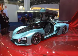 Luxurious Red Hongqi Car On City Street Wallpaper