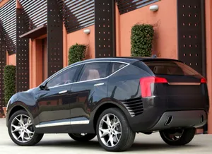 Luxurious Red Hongqi Car On City Street Wallpaper