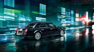 Luxurious Red Hongqi Sedan On A Picturesque Road Wallpaper