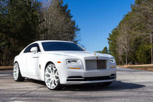 Luxurious Rolls Royce Camargue In Classic Setting Wallpaper