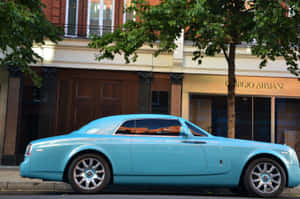 Luxurious Rolls Royce Corniche Glowing Under The City Lights Wallpaper