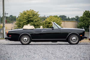 Luxurious Rolls Royce Corniche In Breath-taking Landscape Wallpaper