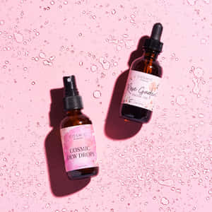 Luxurious Rose Oil In A Glass Dropper Bottle Wallpaper