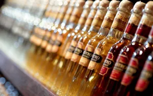 Luxurious Row Of Maestro Tequila Bottles Wallpaper