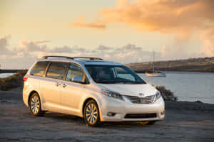 Luxurious Silver Toyota Sienna On The Street Wallpaper