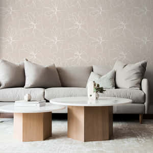 Luxurious Sofa Against A Wall With A Subtle Design Wallpaper