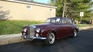 Luxurious Vintage Bentley S2 On Display Wallpaper