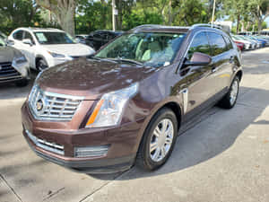 Luxury And Comfort: Cadillac Srx Suv Wallpaper