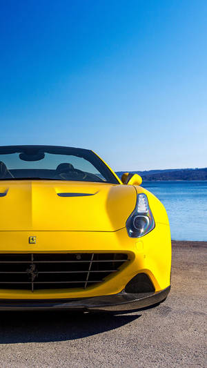 Luxury And Speed: Ferrari F12 Shining Bright In Yellow Wallpaper