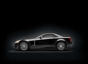 Luxury Cadillac Xlr Sports Car On Display In A Stunning Outdoor Scene. Wallpaper