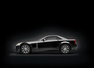 Luxury Cadillac Xlr Sports Car On Display In A Stunning Outdoor Scene. Wallpaper