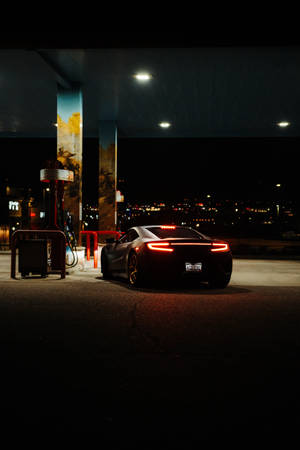 Luxury Car In Gas Station Wallpaper