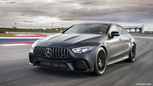 Luxury Coupe Speedingon Track.jpg Wallpaper