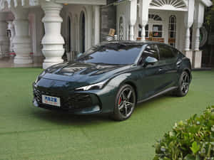 Luxury Green Sedan Front View Wallpaper