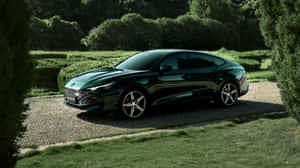 Luxury Green Sedan Parked Outdoors Wallpaper