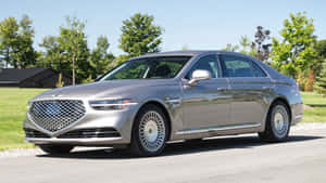 Luxury Redefined: The Genesis G90 In Elegant Maroon Wallpaper