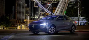 M G5 Electric Sedan Night Cityscape Wallpaper