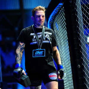 M M A Fighter Beside Cage Octagon Wallpaper