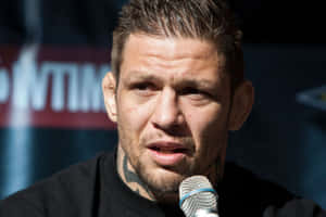 M M A Fighter Speakingat Press Conference Wallpaper